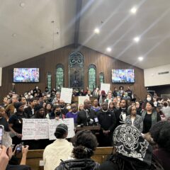 group of faith leaders gather in church